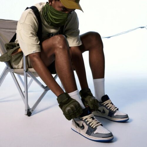 Lifestyle image showing a person lacing up the Air Jordan 1 Low