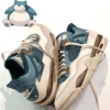 Angled front view of a full pair of Air Jordan 4