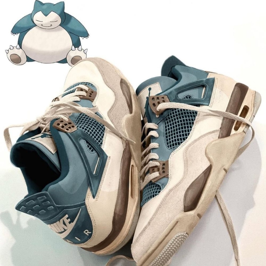 Angled front view of a full pair of Air Jordan 4