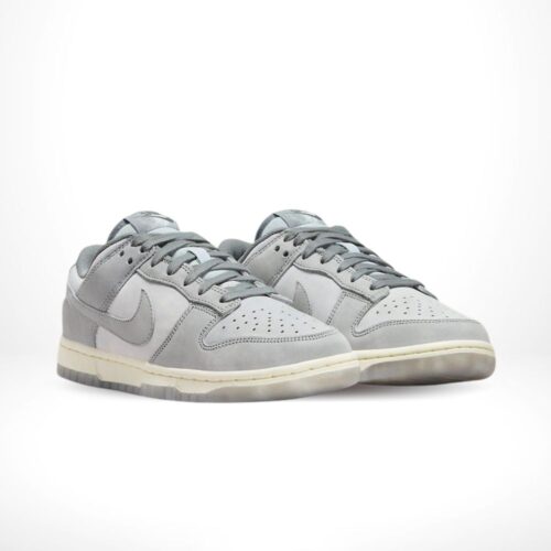 Angled front view of a full pair of Nike Dunk Low